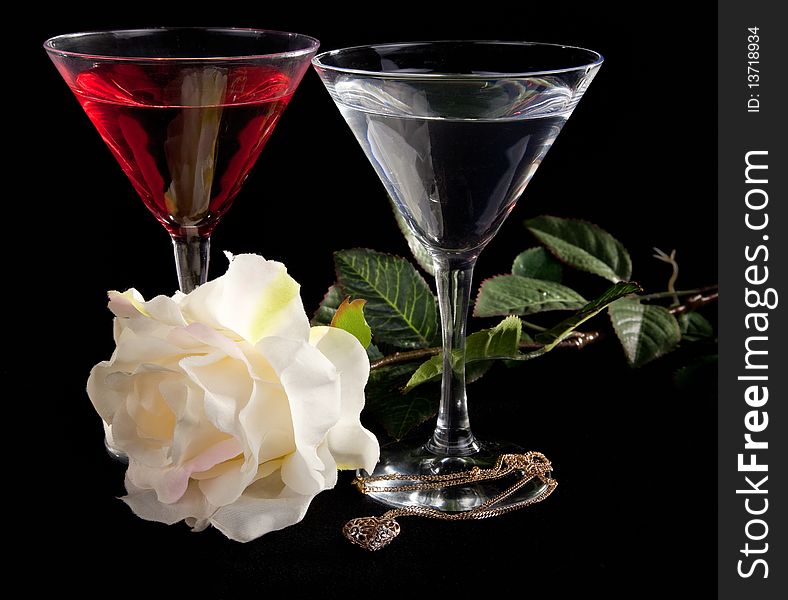 Rose and two glasses of cocktails on a white background