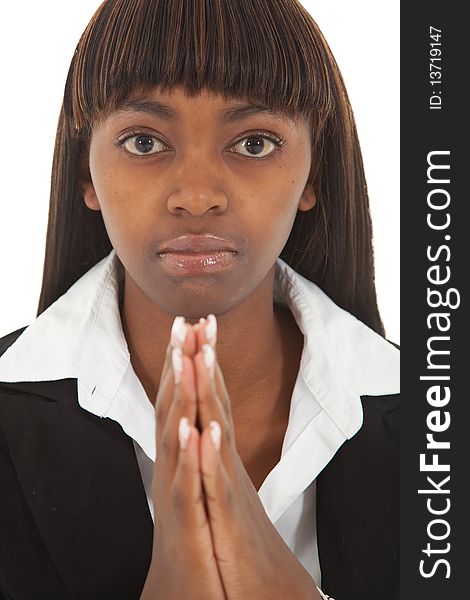 Young black female with serious expression with hands in praying position. Young black female with serious expression with hands in praying position