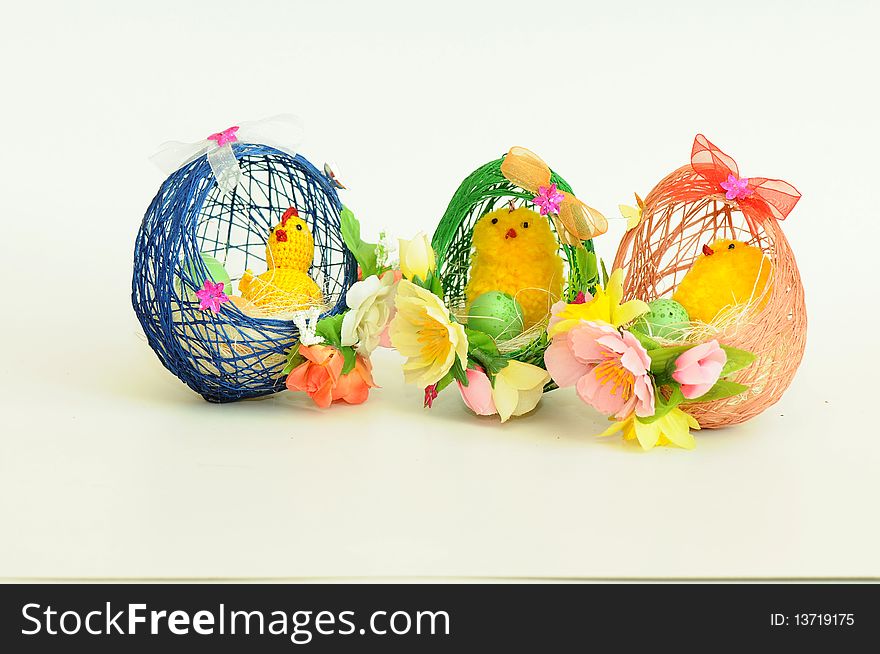 Three little easter chick coming out of a knitted egg. Three little easter chick coming out of a knitted egg