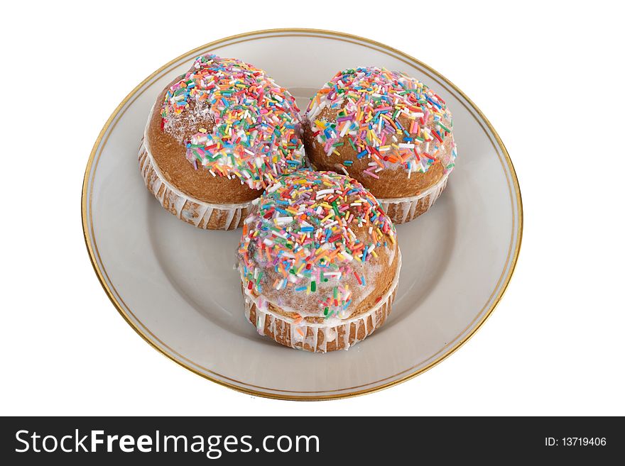 Sweet cakes on plate isolated on white