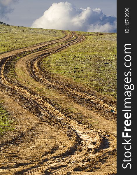 Country road with mud, ruts