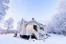 The House In The Forest Has Covered With Heavy Snow In Winter Season At Lapland, Finland Royalty Free Stock Photography