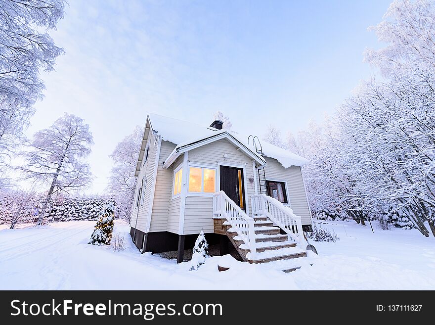 The house in the forest has covered with heavy snow in winter season at Lapland, Finland