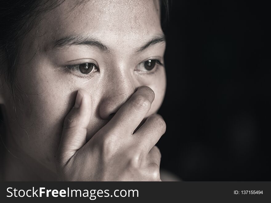 Women sitting on the floor crying with depression, Depressed woman sitting on ground, family problems, kitchen, abuse, Domestic