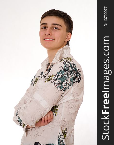 Beautiful young man standing on a white