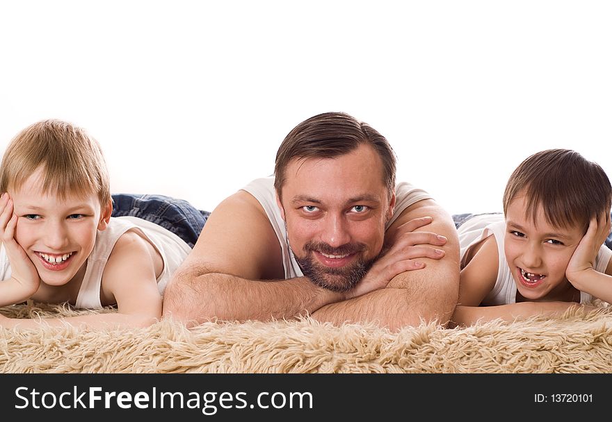 Young family three lying on the bed