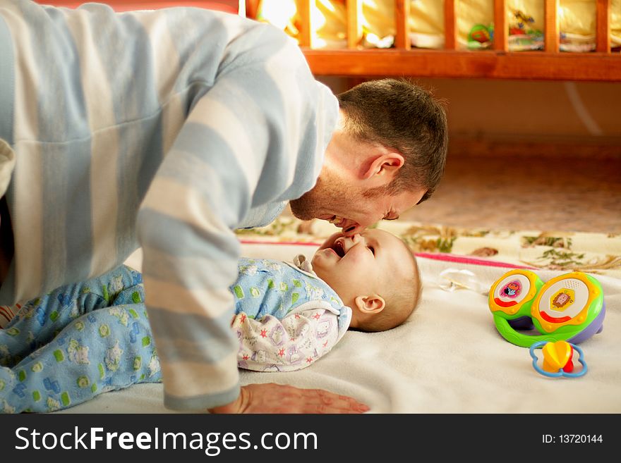 Father is with son to laugh, touched noses. Father is with son to laugh, touched noses