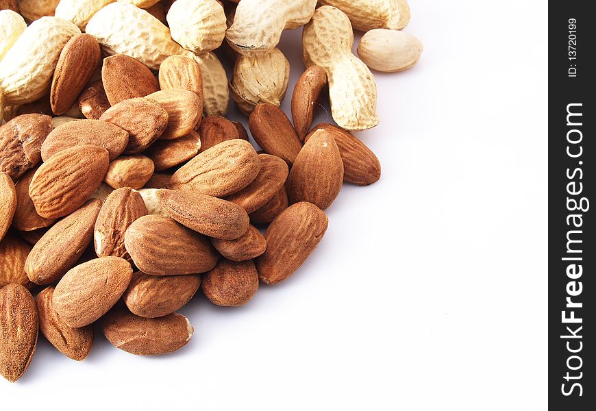 Peanuts, almonds, pistachios, walnuts on white background