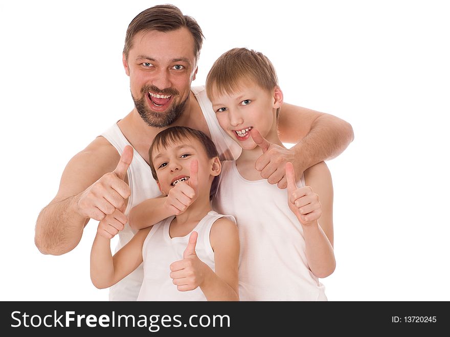 Young father with his two sons standing on a white background