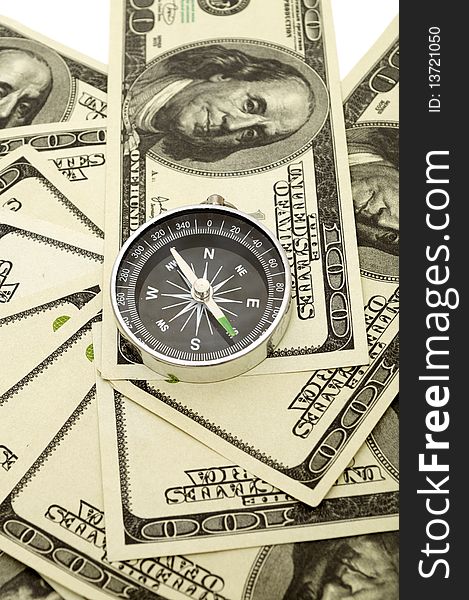 Compass on hundred dollar background