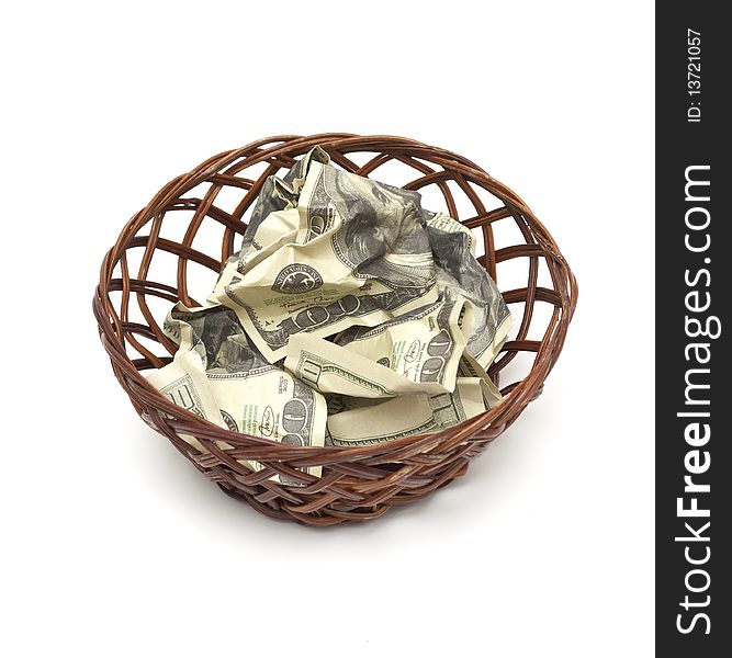 A wicker basket with handle holds a pile of cash. Good for most financial inferences including investment, retirement, savings, wealth and the economy to name a few.