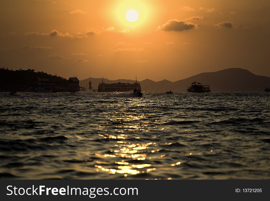 Sun go down between two islands