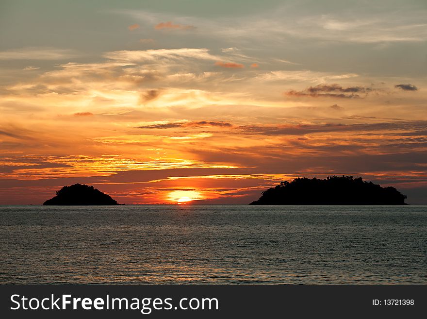 Sun go down between two islands. View from Kai Bae beach. Koh Chang Island. Thailand