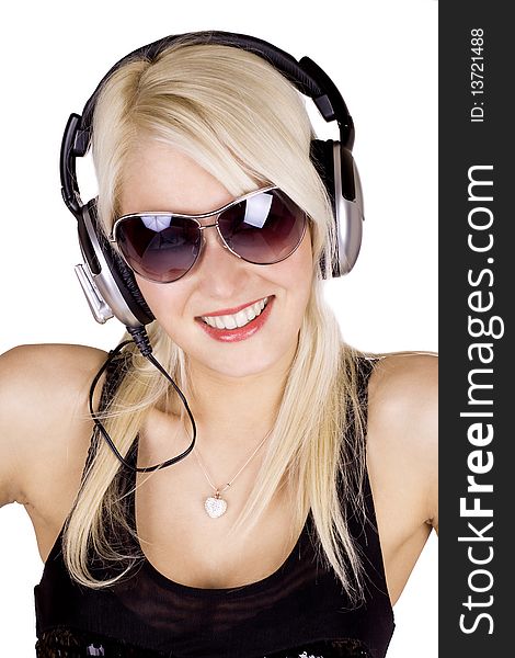 Blond girl listening to music wearing headphones