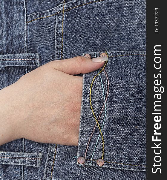 Hand in blue jeans pocket