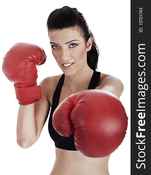 Woman boxer giving a punch over white background
