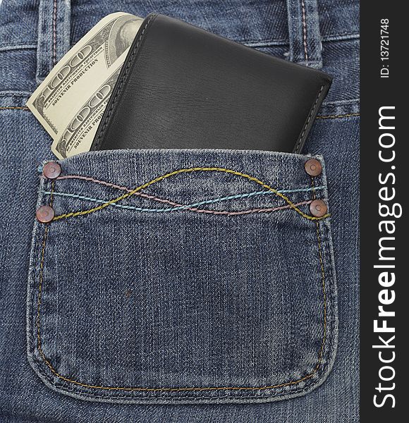 Pocket money. Black leather wallet with dollar bill roll in hip pocket of worn blue jeans close-up.