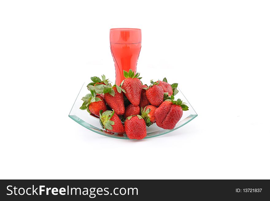 Strawberries and red glass of water. Strawberries and red glass of water