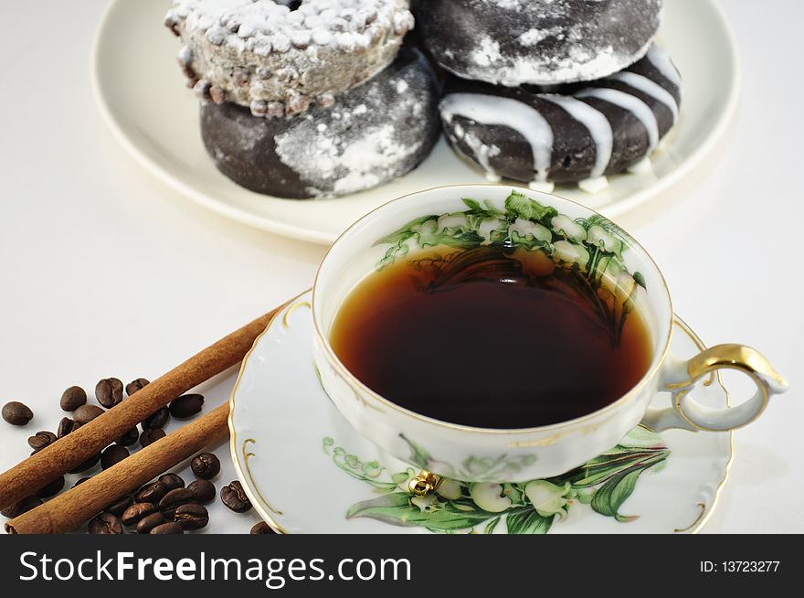 Cap of coffee with donuts on white background. Cap of coffee with donuts on white background