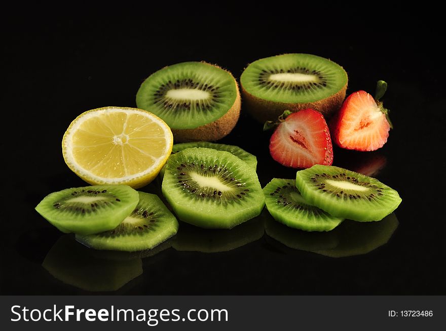 Fresh fruits on black background