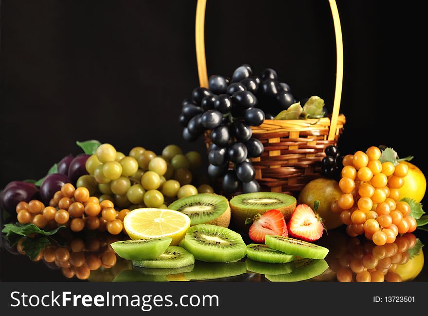 Fresh fruits on black background