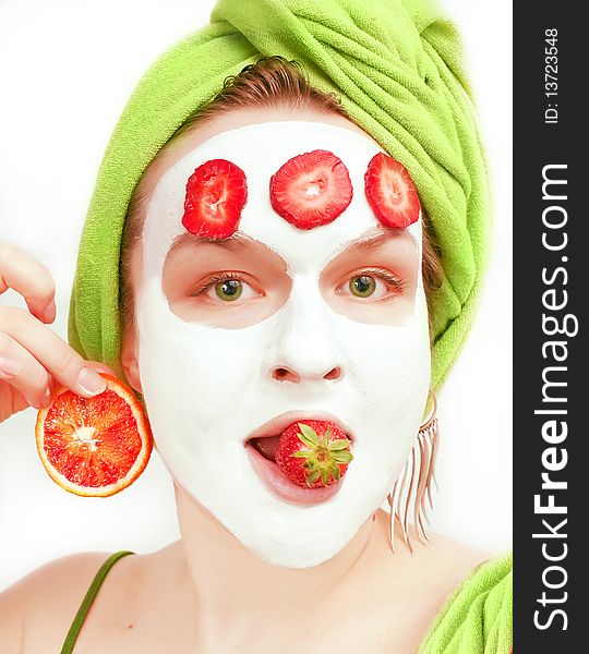 Young women with face mask and fruits