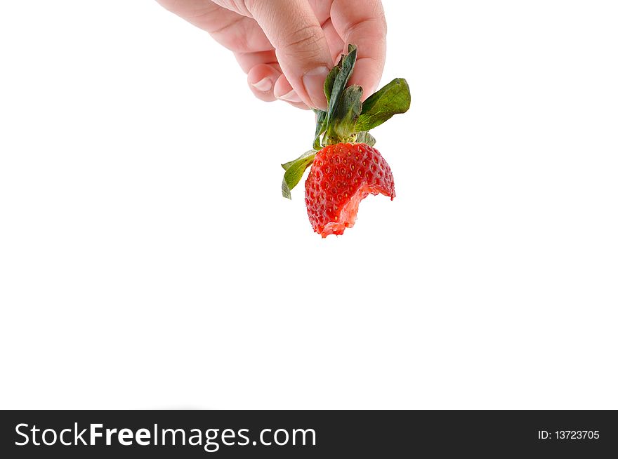 Hand is holding bite strawberry on white isolated. Hand is holding bite strawberry on white isolated