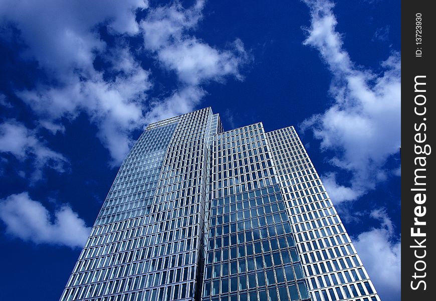 Modern office building with cloudy sky in the background