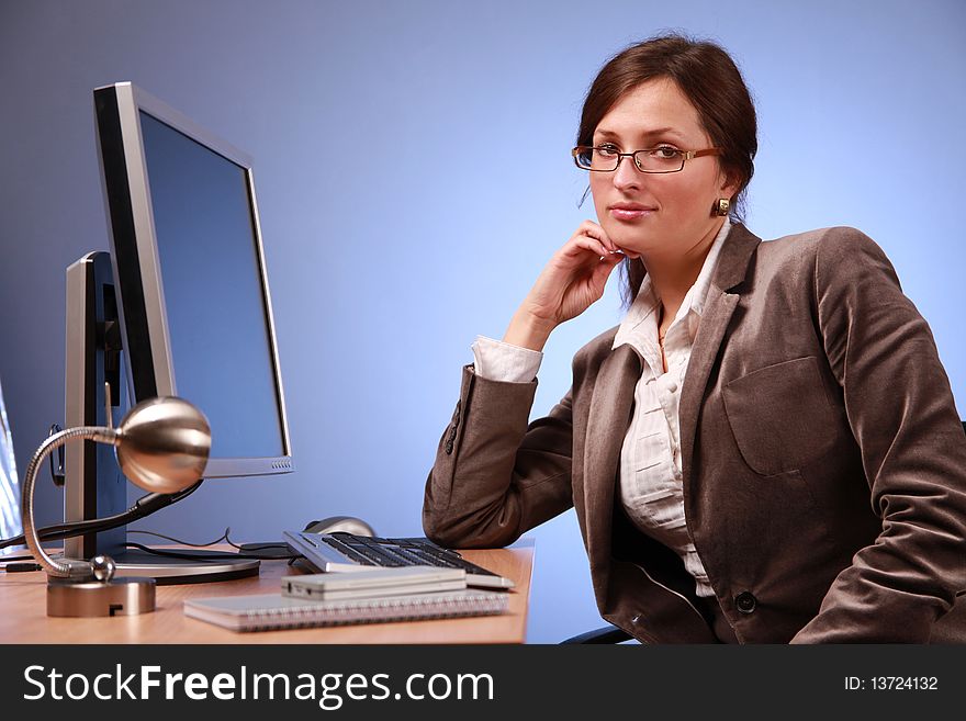 Young businesswoman working in office. Young businesswoman working in office