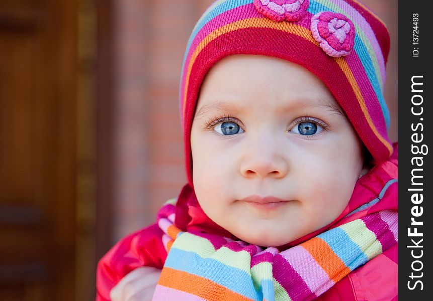 Portrait of beautiful child in stripe cap