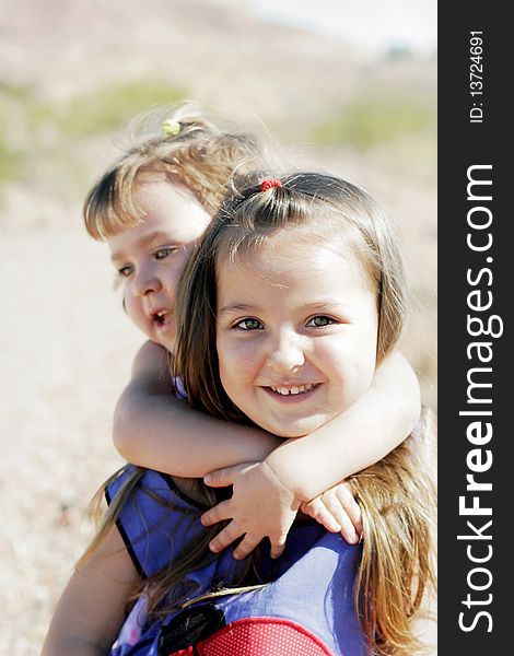 Happy Sisters & A Piggyback Ride