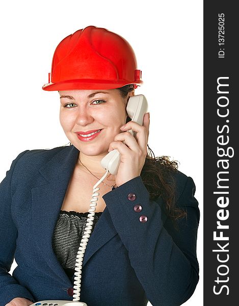Young woman architect in red helmet calling by phone. Isolated on white background. Young woman architect in red helmet calling by phone. Isolated on white background