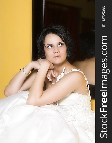 Beautiful brunette bride with short hair and white gown