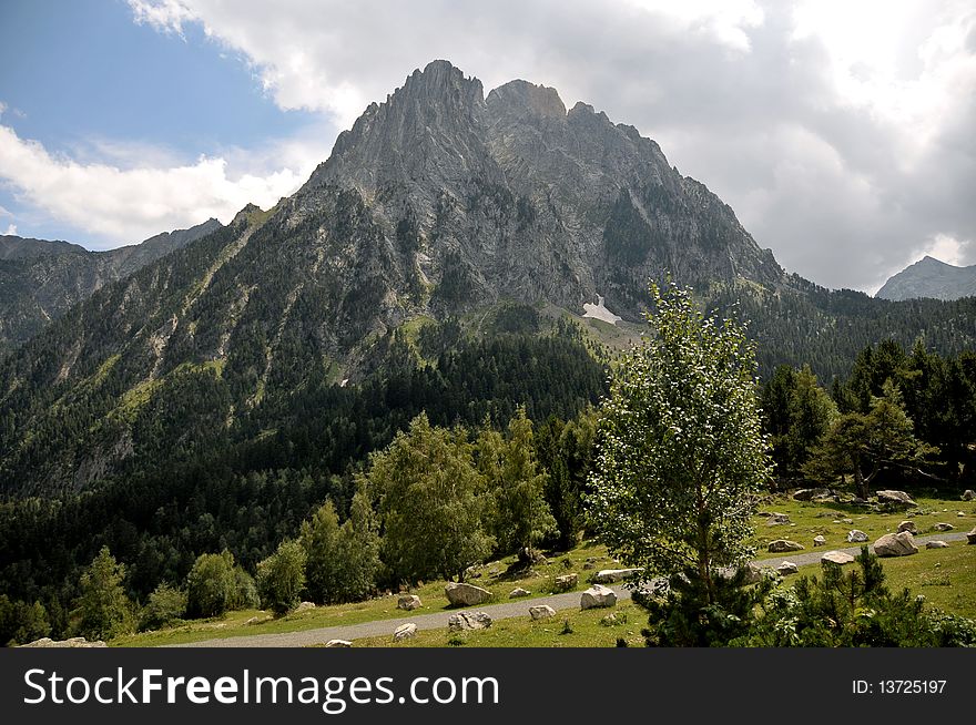 View of a scenic mountain on sky background. View of a scenic mountain on sky background