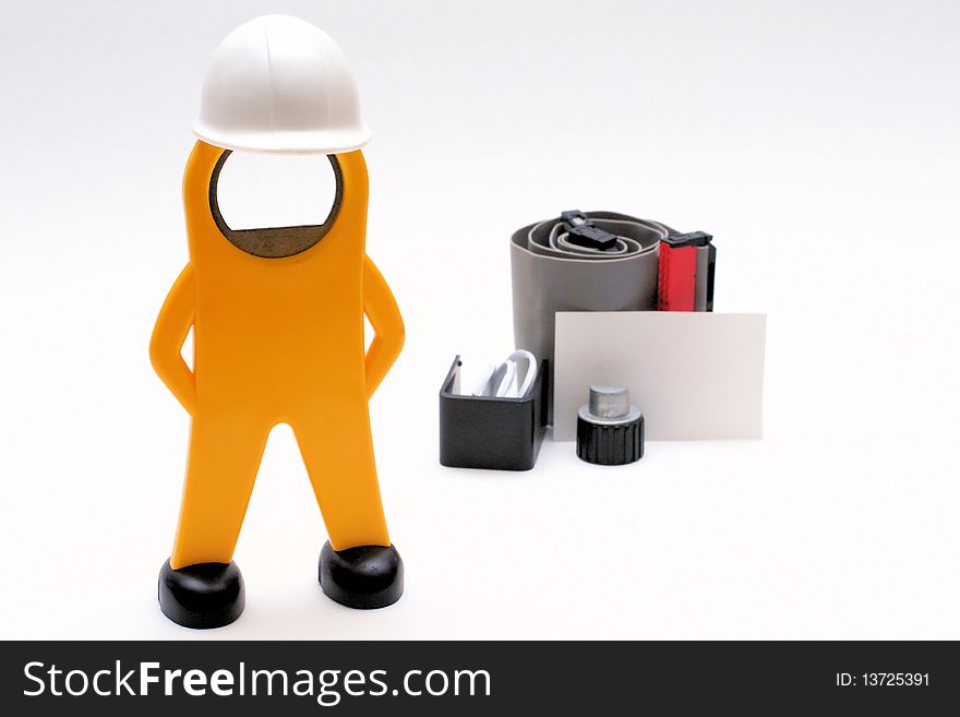 Figure of a worker with helmet, working-material and an empty sign. Figure of a worker with helmet, working-material and an empty sign