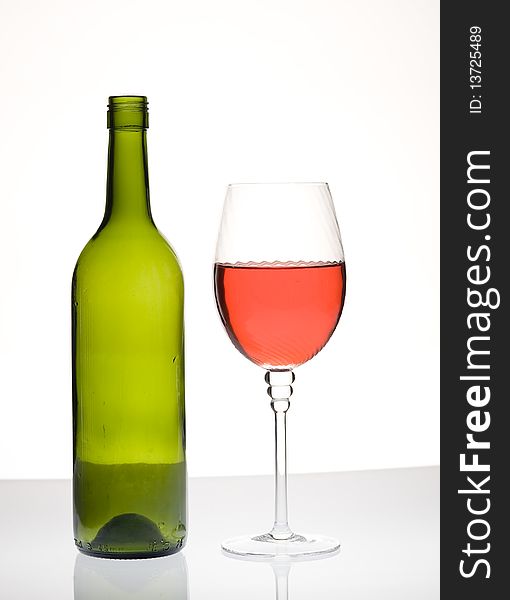 Red wine and bottle isolated on white