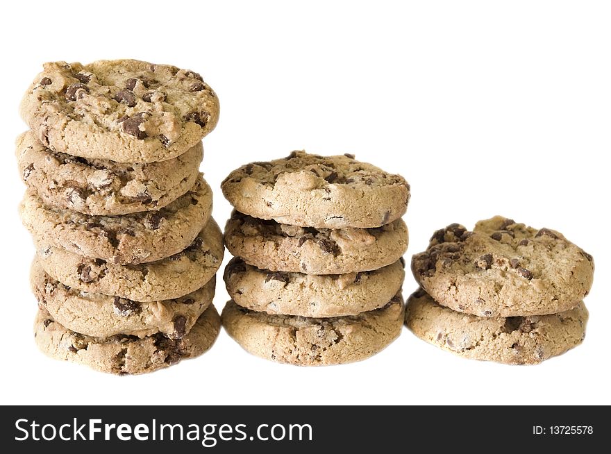 Stacks of chocolate chip cookies, isolated on white