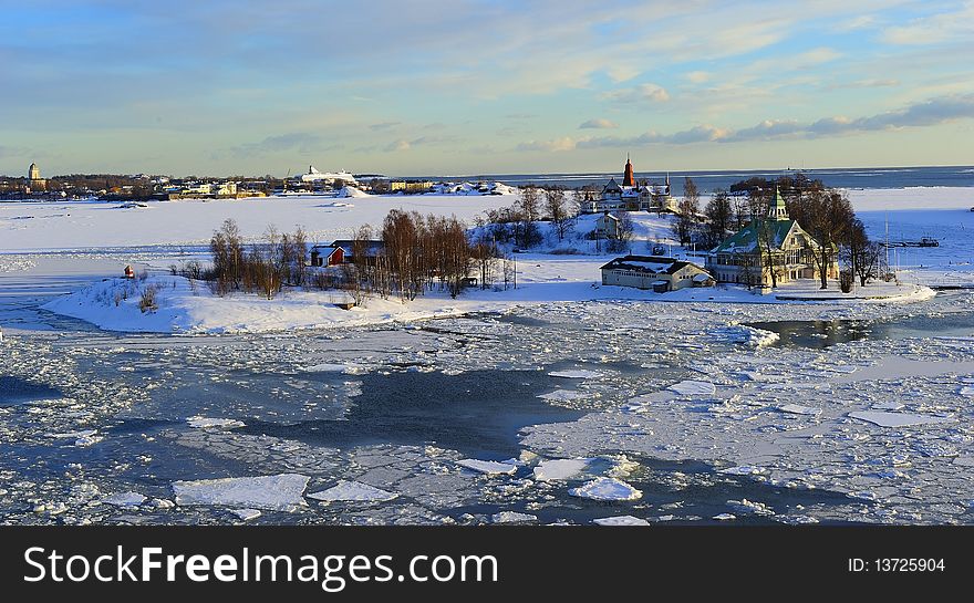 Icy Baltic sea around Helsinki, with Finnish houses on islands. Icy Baltic sea around Helsinki, with Finnish houses on islands
