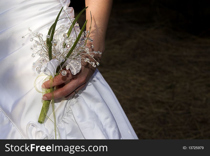 Bride holding a leaf and gemstone bouquet. Bride holding a leaf and gemstone bouquet