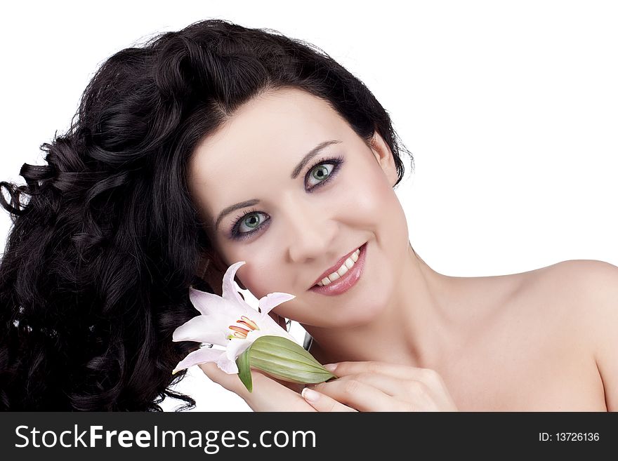 Beautiful woman with a lily flower on a white background. Beautiful woman with a lily flower on a white background