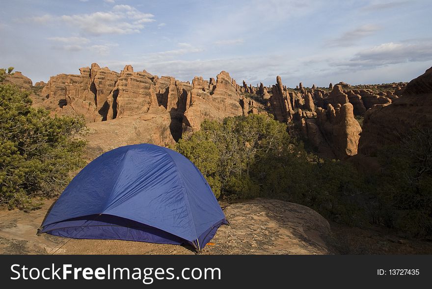 Tent perched on the rocks in the backcountry of Arches. Tent perched on the rocks in the backcountry of Arches