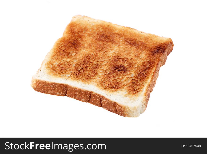 A piece of baked bread isolated on white background.