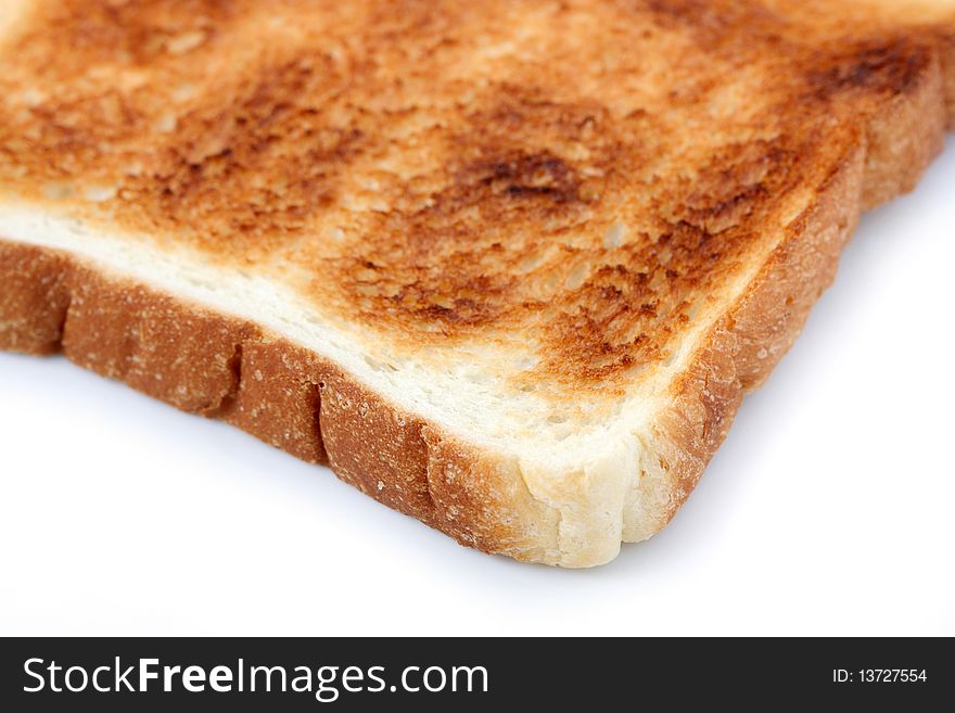 A piece of baked bread isolated on white background.