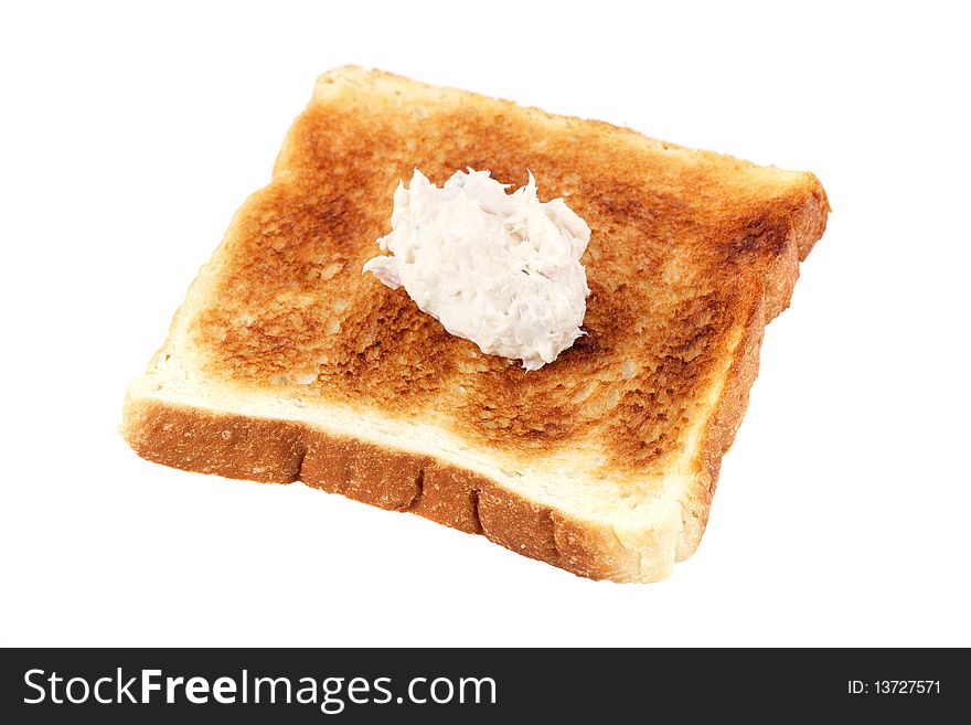 A piece of baked bread with mayonnaise tuna isolated on white background. A piece of baked bread with mayonnaise tuna isolated on white background.