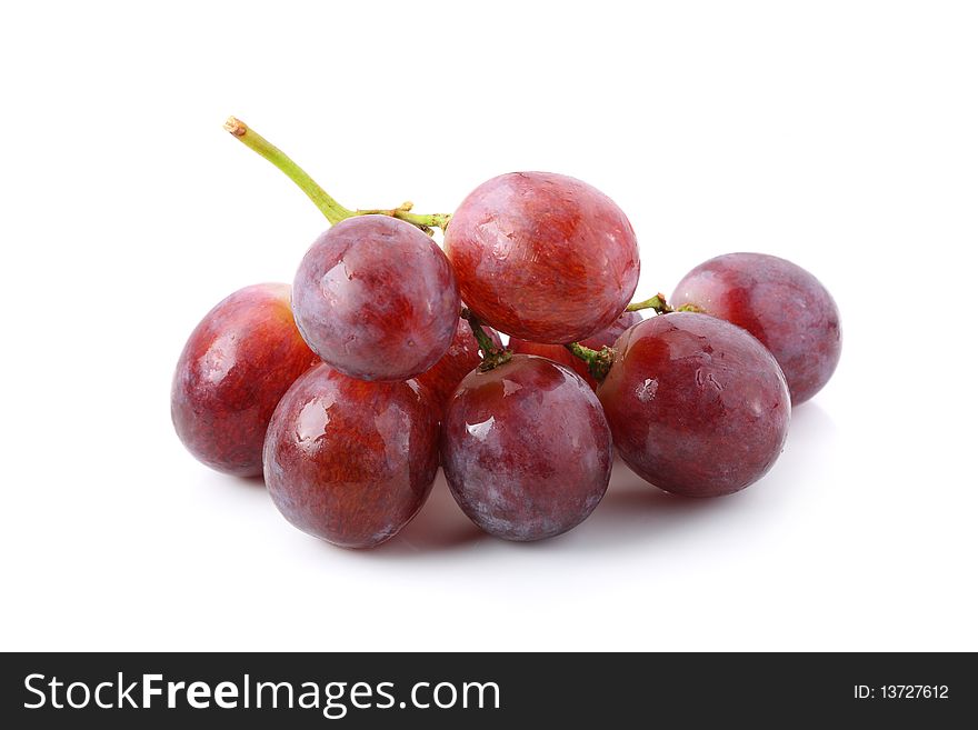 A string of grapes isolated on white background. A string of grapes isolated on white background.