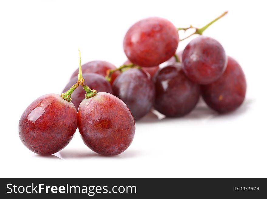 A string of grapes isolated on white background. A string of grapes isolated on white background.