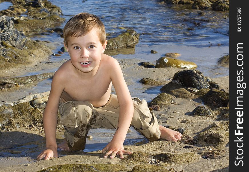 Boy is playing at the beach. Boy is playing at the beach