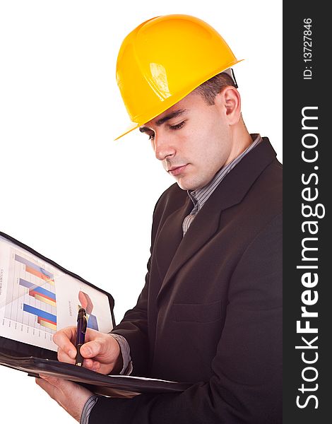 Young attractive businessman with helmet on his head holding documents. Young attractive businessman with helmet on his head holding documents