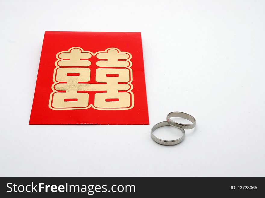 Chinese double happiness packet and marriage ring. Chinese double happiness packet and marriage ring.