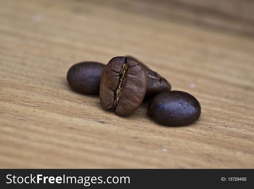 Coffee grains in wood background
